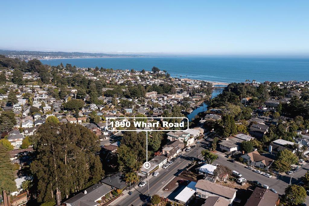 Live or Vacation in one of the Best Beach towns in California - Capitola By the Sea! This single family home has great views and a Dream Location! Perched above Soquel Creek, enjoy peaceful water views, a peek of the ocean and distant mountain vistas. Just a short stroll to Capitola Village, you're steps from the beach, surfing, dining, boutique shopping, live music, and steps from the Legendary and Romantic Shadowbrook Restaurant! Inside, the home features bamboo floors, dual-pane windows, an inviting living room, inside laundry area and an open floor plan that leads to a charming private deck, perfect for relaxing and entertaining. Whether you're looking for a full-time residence, vacation home or investment property, this gem offers the best of Coastal Living and Entertainment, Day and Night, in one of the most desirable beach towns on the California Coast! Rarely do homes like this come available in such a prime location. Garage is partially converted so not full size, but large enough for e-bikes, surf boards and the there is plenty of extra storage under the house. Don't miss your chance to own a piece of Capitola paradise! More photos and drone tour coming soon!