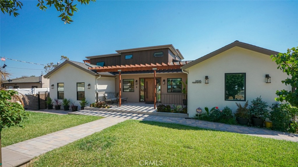 Come see this stunning home completely rebuilt in 2023–2024! It features all-new systems and finishes—including roof, plumbing, electrical, flooring, walls, and more—all with permits. Originally a 2-bedroom, 2-bath, 1,400 sq ft home, it is now a spacious 5-bedroom, 4.5-bath, 3,240 sq ft residence with thoughtful design and modern functionality. Ideal for entertaining guests, the open-concept living and dining rooms flow seamlessly into a custom kitchen with a large island, premium stove, custom-built cabinets, and hidden-panel refrigerator. Two electric fireplaces enhance the living and family rooms, offering both functional heat and elegant ambiance. The main floor includes 2 bedrooms, 2 bathrooms, and a versatile bonus room that can be used as an office, guest space, or sixth bedroom. The primary suite features abundant natural light, a walk-in closet, and a luxurious en-suite with a rain shower that doubles as a steam room. Upstairs, 3 additional bedrooms include a Jack-and-Jill bath, private balconies, and a bedroom with its own bath and walk-in closet. Modern amenities include built-in surround sound, smart toilets, sensor-activated bathroom lighting, heated towel racks, full surveillance, and alarm system. Three separate AC units allow each level to maintain its ideal temperature, while a whole-house water filtration and softener system ensures clean water for drinking and bathing. The backyard offers beautiful mountain views, a saltwater pool, fruit trees, and hookups for future outdoor upgrades. The remodeled garage includes insulation and recessed lighting ideal for a pool/guest house or potential ADU (buyer to verify with city). Situated in a top-rated school district, this home combines size, luxury, and location—schedule your private tour today!