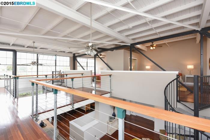Sensational tri-level corner unit mins from SF, combines expansive versatility w/functional space. Features include open kitchen/living area, double mezzanines w/closets & catwalk to additional flex space, ground floor workshop w/laundry hook-ups, 1 bath, skylights, 2 car pkg & more.