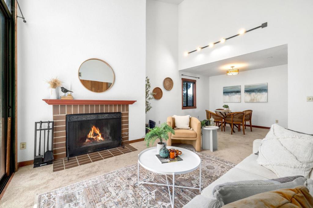 Once in a while, a truly special spot becomes available in this beautifully landscaped complex. Pacific Terrace is meticulously maintained, and it shows. Our penthouse unit is perfectly situated, offering convenience to Whole Foods, Shoppers Corner, and Spenga for your workouts. You can easily walk to downtown or enjoy a short ride to the beach and Boardwalk. This unit is warm and comfortable, featuring designer wood accents, vaulted ceilings, and a fabulous, sunny, covered deck. You'll find stainless steel appliances and a bright, airy layout with two bedrooms and two bathrooms. Parking is a breeze with gated underground parking, and the entire complex is secure. Take the stairs or zip up in the elevator to enjoy a bird's-eye view. The complex also boasts a delightful pool, spa, and BBQ area, so you might never want to leave! Where else can you find all these amenities for under a million dollars?