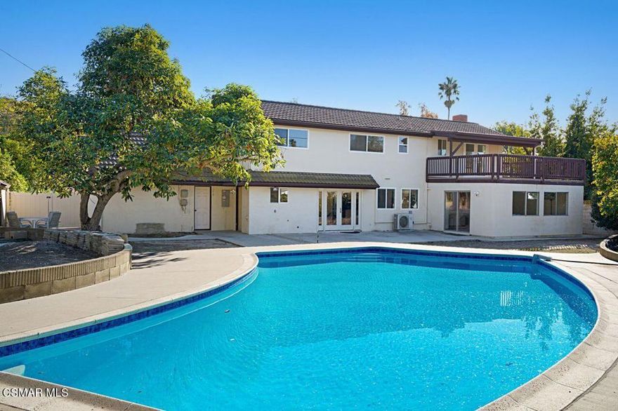 Beautiful corner pool home on an expansive parcel.  This amazing property is located in a wonderful neighborhood and offers an array of highly desirable features.  The home sits on a parklike corner lot with an impressive front yard.  This blank canvas in ready to become a green thumb's paradise.  Attractive  hardscaping and mature fruit trees, and a long driveway provide plenty of parking and curb appeal.  Step inside to discover gorgeous, tasteful, wood-like ceramic tile flooring throughout the entire downstairs.  The bright and inviting living room features a striking stack-stone gas fireplace and opens to the family room which is an ideal space for an art studio, reading nook or sunny dining area.  The beautifully remodeled kitchen is a chef's dream, complete with quartz counters, soft-close cabinetry, a center island, farmhouse sink, and stainless steel appliances.  Enjoy the convenience of downstairs living with a spacious bedroom and bath featuring a double sink vanity and stunning stone/tile shower.  Upstairs, the large, light-filled primary suite includes a private deck, generous closets and an ensuite bath.  Two additional bedrooms offer ample closet space and share a remodeled full bath.  The home also features a large laundry room with abundant cabinetry and outdoor access to the expansive backyard.  Entertain or relax by the sparkling pool surrounded by patios, stone fountain and mature fruit bearing trees.  There is a large built-in storage shed  which adds even more functionality.  Lots of room to add an ADU/guest house.  Plenty of room to park an RV, boat or other vehicles.  This exceptional property combines space, comfort and style.  A perfect blend of indoor-outdoor California living.  No HOA.  Near Old Meadows Park,  Conejo Creek Park, the Goebel Adult Center, Thousand Oaks Teen Center and Thousand Oaks Library.  Don't miss this opportunity, your next chapter starts here!