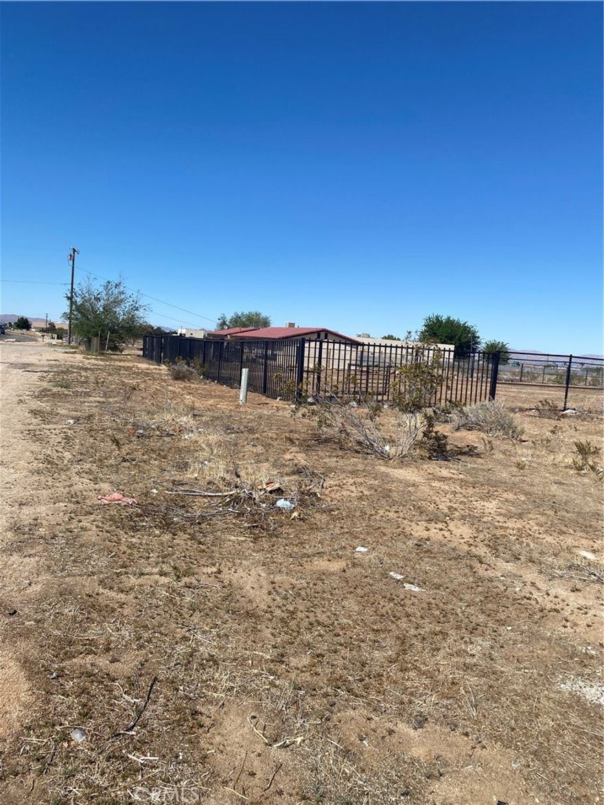 Great Parcel of Commercial Land, it's level and fenced. Close to several Businesses, lots of potential.