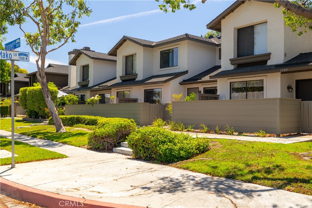 Now don't miss this one. These townhomes rarely come up and are highly desired. Stylish Two-Bedroom Townhome in the Highly Desirable Lakeview Townhomes Community! Close to all the wonderful Southern California attractions. Disney, Knotts, Down town Disney, shopping, dining and close to the surf town of Huntington Beach.
Step into this bright, airy, and beautifully updated two-story home in the heart of Anaheim! With soaring vaulted ceilings and abundant natural light, the open-concept living and dining areas create the perfect setting for everyday comfort and entertaining. The upgraded kitchen shines with elegant cabinetry, recessed lighting, and generous counter space—an ideal blend of style and function.
Upstairs, you’ll discover two spacious bedrooms, including a serene primary suite with a large closet and plenty of storage. Thoughtful designer touches throughout, including a color-coordinated stair rail that complements the kitchen palette. Even more storage is available in the attached two-car garage, featuring an insulated, upgraded garage door.
Enjoy California sunshine on your private, gated front patio—beautifully enhanced with charming brick pavers for added curb appeal and outdoor enjoyment. Community Perks You'll Love: Resort-style pool & spa, Scenic greenbelts & lush landscaping,Peaceful private lake and peaceful brook nearby
Prime Location! Minutes to the 91 Freeway, top-rated shopping, dining, and attractions including Disneyland, Knott’s Berry Farm, and the trendy Anaheim Packing District.
This is the home you’ve been waiting for—don’t miss your chance to own a gem in Lakeview Townhomes!