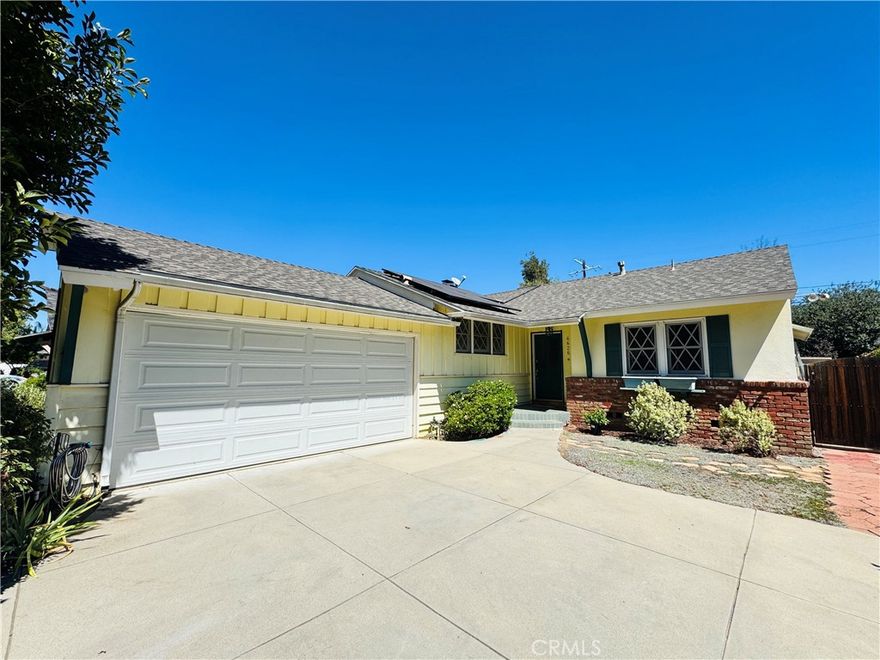 Lovely home with solar in a charming neighborhood is available FOR LEASE! This spacious 4 bedroom, 2 bath home is situated on a quiet tree lined street in Van Nuys. This home is endearing with a living-dining room combination plus a family room/den with beamed ceilings, central AC/heat, ceiling fans, ample parking, and **Solar Panels**. Sizable bedrooms all on one floor. The bright kitchen offers tons of cabinet space and counters with a refrigerator, stove/range, and dishwasher. The primary bedroom features a seating area, access to the private backyard, plus an attached bathroom. The dining area and living room have an open concept with beautiful wood floors and a Venetian plastered fireplace. The fully fenced patio, pergola, and back yard are an amazing added feature perfect for entertaining, hosting get-togethers, and BBQ's. Utilities are not included, but all appliances and gardener are included. Only one house on lot and includes; refrigerator, stove/oven, dishwasher, freezer in garage, washer and dryer, plus garage and multiple driveway spaces. Property is conveniently located near restaurants, shopping, and public transportation. Call or text to schedule a viewing today!