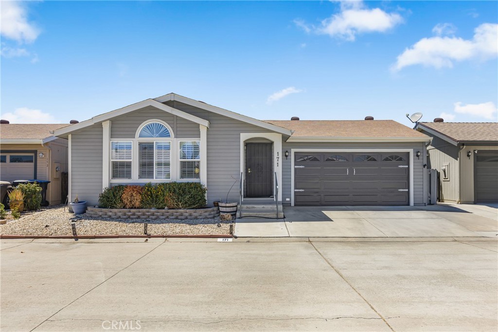 Welcome to this beautiful 3 bedroom, 2 bath manufactured double wide home built in 2004, perfectly located in the heart of Menifee. Step inside to an inviting open living area with an airy, open-concept kitchen featuring white appliances and plenty of space for entertaining. The home offers cozy carpet throughout, adding a warm, comfortable touch throughout. Outside, you’ll love the large backyard with updated landscaping, turf, and a covered patio, perfect for barbecues, relaxing, or hosting family and friends. The community provides excellent amenities including a refreshing pool, giving you resort-style living close to home. Conveniently located near the 215 freeway, shopping centers, restaurants, Starbucks, and local grocery stores, this home offers both comfort and accessibility. Don’t miss your chance to own a spacious, well-kept home in Menifee, schedule your showing today!