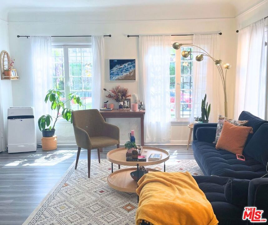 Experience timeless charm and modern comfort in this beautifully maintained 1-bedroom, 1-bath residence, located in a classic Spanish-style building in the heart of Fairfax. This inviting home offers a bright and airy layout with character-rich architectural details that showcase its vintage appeal. Just moments from The Grove, the Original Farmers Market, and the vibrant shopping and dining along Beverly, Fairfax, and Melrose, this location puts some of Los Angeles' most iconic destinations right at your doorstep. Adding to its appeal, the unit includes its own private 1-car garage perfect for either secure parking or additional storage, whichever suits your lifestyle best. With its unbeatable location, rare amenities, and boutique 6-unit setting, this home is the ideal choice for anyone seeking both character and convenience in the heart of LA.