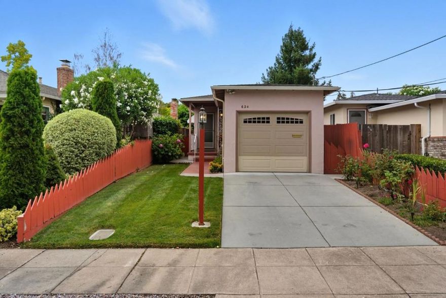 This classic single level  home lives up to its street name Sapphire a real gem.  Bursting with personality, the 2-bedroom, 1-bath residence is a true retro gem with its playful pink-and-green bath and bright, cheery yellow kitchen complete with a coveted Wedgewood stove.  Inside, enjoy refinished hardwood floors, newer windows throughout, and the peace of mind of a newer roof. The attached one-car garage includes front-loading washer and dryer for convenience. Step outside to impeccable landscaping roses and hydrangeas frame the front, while the backyard offers a covered patio & pavers perfect for entertaining, and a more flourishing hydrangeas and a lemon tree ready for picking. Located within walking distance to Red Morton Park, Dehoff's Key Market, and neighborhood favorites, this home combines vintage charm with modern updates. Add your personal touch, and you'll have home sweet home in the heart of it all.