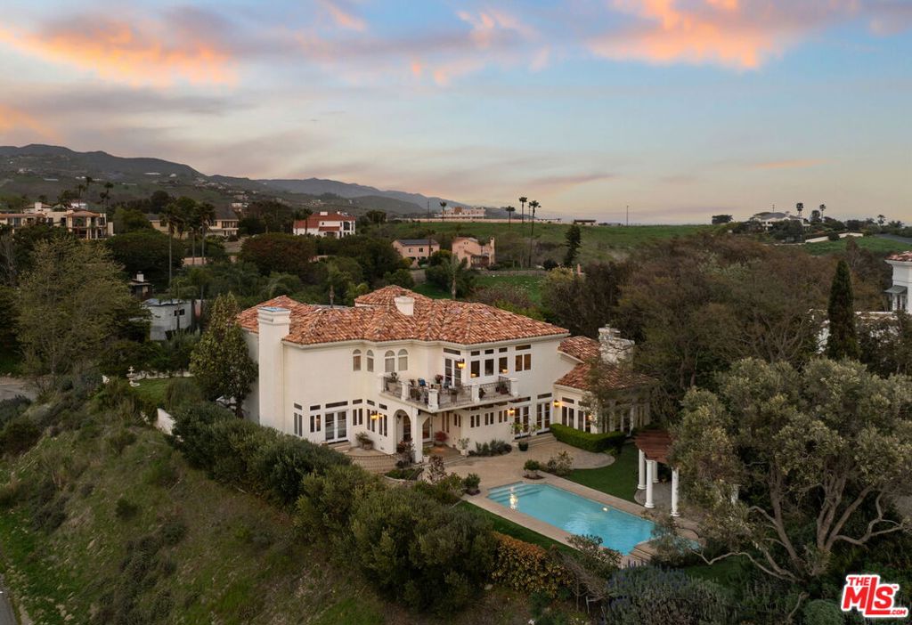 Welcome to one of the BEST BUYS in all of Malibu! Priced at $838/SqFt. This California meets Tuscan Estate is the perfect home that offers Ocean and Mountain views, Pool, Jacuzzi, is privately gated, lush landscaping and is located on a cul de sac street. Step inside to soaring ceilings, exquisite limestone flooring, and a bright, airy interior that enhances the home's spacious and open design. The estate's exceptional craftsmanship is evident in the elegantly appointed library, formal living, and dining rooms. Wide-plank oak flooring flows effortlessly through the inviting family room, chef's kitchen, and charming dining nook, where garden and ocean views create a picturesque setting. French doors open to a resort-style backyard featuring multiple entertainment spaces, stunning vistas, and a recently renovated pool and spa. A lush side yard serves as a tranquil retreat for various activities. The lower level includes two en-suite bedrooms, a laundry room, and a powder bath, while a striking custom wrought-iron spiral staircase in the grand rotunda leads to the upper floor. Wake up to breathtaking ocean views in the primary suite, complete with a private balcony, an oversized soaking tub, a large shower, and dual walk-in closets. Two additional generously sized en-suite bedrooms provide a peaceful ambiance with serene mountain views. This stunning estate is perfectly situated just minutes from world-class dining, pristine beaches, and breathtaking hiking trails. Whether you're exploring the vibrant Malibu scene or unwinding in your own private paradise, this estate provides the perfect blend of luxury, comfort, and convenience.