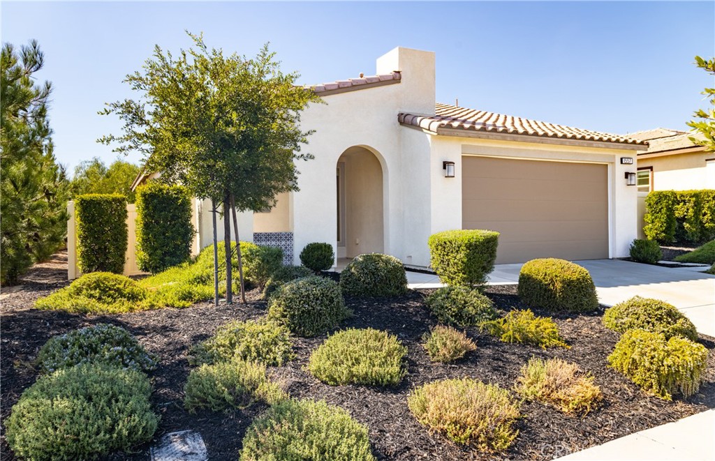 Adorable single-story home with PAID SOLAR located in a highly desirable 55+ gated community! This 2-bedroom, 2-bathroom home offers an open floor plan with a versatile den that can also be used as an office. The kitchen is beautifully upgraded with quartz countertops, custom backsplash, pendant lighting, and stainless steel appliances—including refrigerator, washer, and dryer. Additional upgrades include recessed lighting throughout, upgraded flooring, and a spacious primary suite featuring a large custom-tiled shower. Enjoy the fully landscaped backyard, perfect for relaxing or entertaining. The home also comes equipped with solar panels, making it energy efficient and cost-effective. Residents at Altis have access to the community clubhouse, which offers resort-style amenities such as a full gym, sparkling pools, an outdoor cooking area, and a calendar full of exciting community events. Do not miss this incredible opportunity to own a beautifully upgraded home in a vibrant 55+ community!