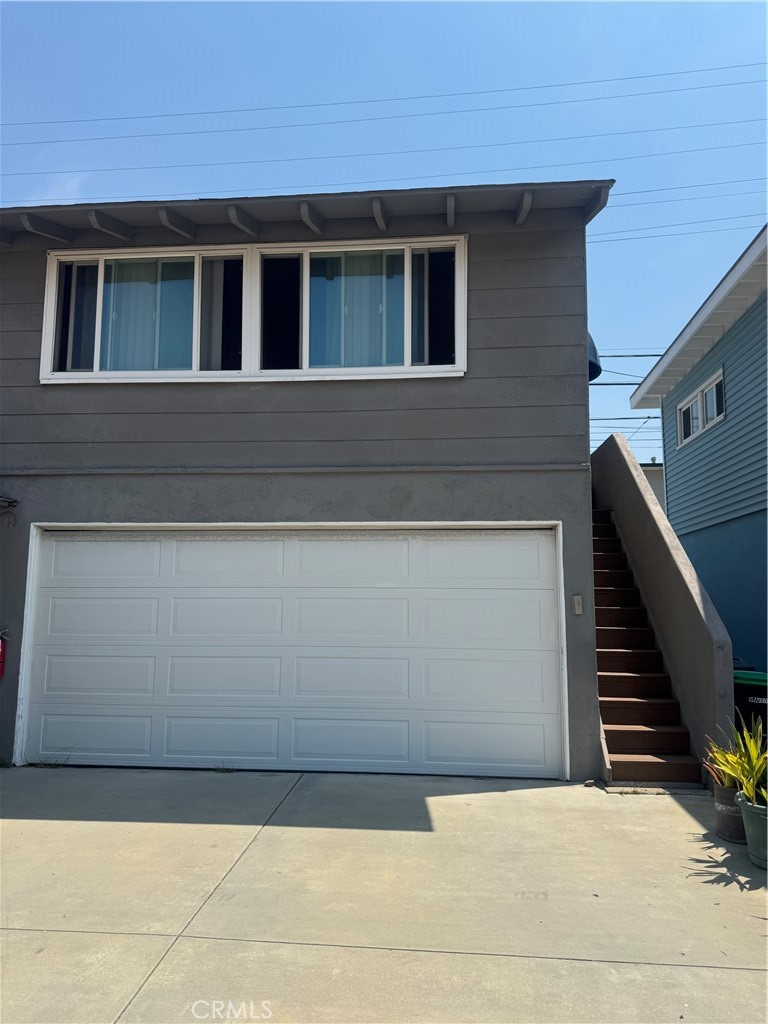 Charming studio apartment in a San Clemente triplex just steps from the beach and Del Mar Street, featuring vaulted wood-beam ceilings, hardwood floors, and abundant natural light throughout. Perched above the garage with an ocean view, this private unit offers a kitchenette with gas stove, oven, fridge, and cabinet storage, along with a full bathroom and flexible open living space. Shared laundry is available on-site, street parking is convenient, and all utilities are included, making this an ideal coastal retreat within walking distance to surf, shops, and restaurants. Do not miss this one!