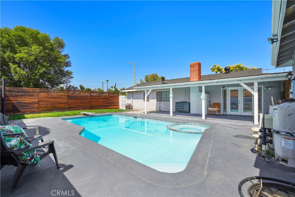 Welcome to 20854 Runnymede Street, a charming 4-bedroom, 2-bath home tucked away at the end of a quiet cul-de-sac in Winnetka. This beautifully updated residence offers 1,303 sq. ft. of living space on a generous 7,609 sq. ft. lot, combining modern upgrades with inviting indoor-outdoor living.
Step inside to find brand-new flooring throughout and a spacious living room featuring a cozy gas fireplace. Double French doors open to the backyard, creating a seamless flow for entertaining. The kitchen is well-appointed with granite countertops, abundant cabinetry, and plenty of space to prepare and enjoy meals. The backyard is a true retreat, complete with a covered patio, heated pool, and spa, perfect for year-round relaxation. Decorative wood-paneled fencing surrounds the grassy area, providing warmth and character. Additional highlights include a detached garage converted into a versatile bonus room, a wide driveway with extra parking, RV access, and a brand-new roof for peace of mind. With its prime cul-de-sac location, thoughtful upgrades, and resort-style outdoor space, this property is ready to welcome you home.