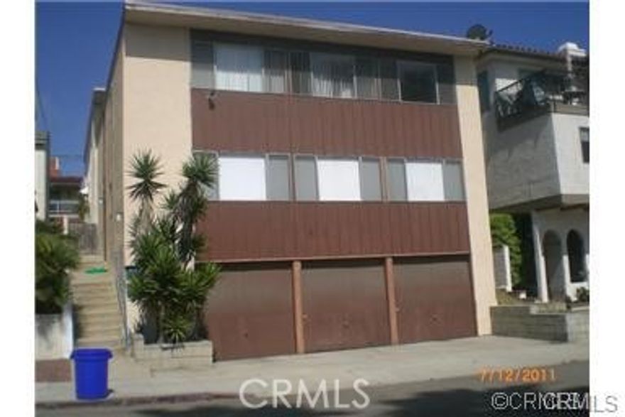 Welcome to 1454 Manhattan Ave...a one level, hard to find bottom apartment unit loaded with 3 bedrooms and 1.75 bathrooms.  Carpeted bedrooms plus laminate flooring in oversized bright living room, easy cleaning. A single garage is the kicker with this unit. You know the location...a 5-minute brisk walk to the sand! This should go fast at this price...thanks.