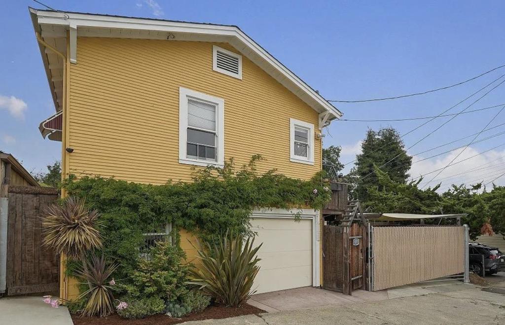 Charming Vintage Cottage with In-Law Potential Near Downtown! This delightful 2-bedroom, 2-bath vintage cottage offers 1,257 sq ft of inviting living space with a flexible floor plan perfect for multi-generational living or potential ADU conversion. The kitchen features classic tile finishes, a high-end 6-burner Bosch range, and a dishwasherideal for home chefs. Enjoy the warm ambiance of the living room with hardwood floors and an enclosed front porch that adds character and extra space. Each level includes one bedroom and one bathroom, offering privacy and versatility. The laundry area is conveniently located just off the kitchen. The one-car garage has been converted into a comfortable living space but can easily function as an oversized garage if preferred. Outside, youll find stamped concrete walkways, a charming garden area, a 10x15 shed for storage or hobbies, and a gated parking area that fits two vehicles. Located just minutes from downtown, the weekly Farmers Market, waterfront parks, and the SF Ferry Terminal. This home blends charm, functionality, and location into one functional package!
