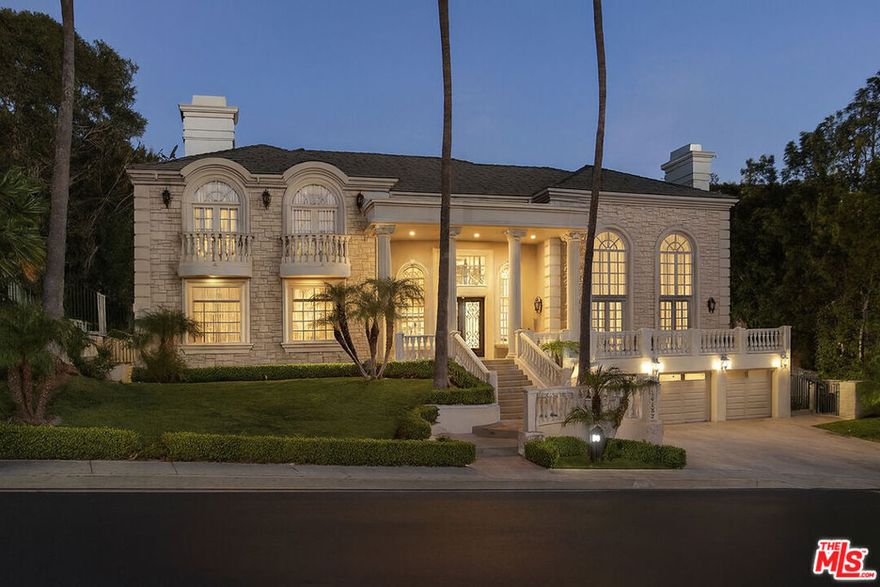 Set behind the gates of the exclusive Mulholland Estates, this grand residence combines timeless European architecture with resort-style living  now vacant, remodeled, and available for immediate showings. From its commanding faade with stone detailing, columned entry, and manicured grounds, to sweeping lawns and hillside views, this home stands as one of the community's most impressive offerings. Inside, soaring ceilings and light-filled interiors showcase elegant proportions and a refined, neutral palette. The formal living room is designed for both comfort and entertaining, with expansive windows, French doors opening to the pool terrace, a stately fireplace, and a sleek wet bar. The remodeled kitchen blends style and function with Caesarstone counters, designer glass tile backsplash, Viking 8-burner range, built-in oven and steamer, Sub-Zero refrigeration, and a generous breakfast area overlooking the gardens. The home's thoughtful floor plan features four bedrooms upstairs, including a dramatic primary suite with dual walk-in closets, dual bathrooms, a sitting lounge, and a two-sided fireplace. A fifth bedroom is located downstairs, while a versatile bonus room provides the option for a sixth bedroom, gym, or creative space. Additional highlights include a professional recording studio, recreation room with direct garage access, and seamless indoor-outdoor flow. The private backyard is a true retreat, complete with pool, spa, gazebo, lush landscaping, and an expansive lawn. A rare opportunity to acquire a beautifully remodeled estate in one of Los Angeles' most prestigious guard-gated communities.