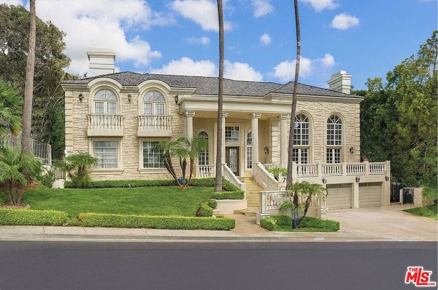 Set behind the gates of the exclusive Mulholland Estates, this grand residence combines timeless European architecture with resort-style living  now vacant, remodeled, and available for immediate showings. From its commanding faade with stone detailing, columned entry, and manicured grounds, to sweeping lawns and hillside views, this home stands as one of the community's most impressive offerings. Inside, soaring ceilings and light-filled interiors showcase elegant proportions and a refined, neutral palette. The formal living room is designed for both comfort and entertaining, with expansive windows, French doors opening to the pool terrace, a stately fireplace, and a sleek wet bar. The remodeled kitchen blends style and function with Caesarstone counters, designer glass tile backsplash, Viking 8-burner range, built-in oven and steamer, Sub-Zero refrigeration, and a generous breakfast area overlooking the gardens. The home's thoughtful floor plan features four bedrooms upstairs, including a dramatic primary suite with dual walk-in closets, dual bathrooms, a sitting lounge, and a two-sided fireplace. A fifth bedroom is located downstairs, while a versatile bonus room provides the option for a sixth bedroom, gym, or creative space. Additional highlights include a professional recording studio, recreation room with direct garage access, and seamless indoor-outdoor flow. The private backyard is a true retreat, complete with pool, spa, gazebo, lush landscaping, and an expansive lawn. A rare opportunity to acquire a beautifully remodeled estate in one of Los Angeles' most prestigious guard-gated communities.