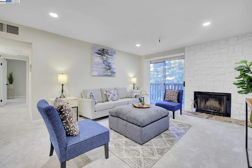 Why rent when you can own? This Hayward Hills top floor corner unit condo is nestled in a quiet, wooded community yet just minutes from downtown Hayward with shopping, restaurants, theaters, and more. The updated unit features fresh interior paint, new LVP flooring and carpet, recessed lighting in the living room, and a stylish kitchen with stone countertops and crisp white cabinetry. Enjoy the convenience of in-unit laundry. The community offers an elevator, secure gated underground parking, and a sparkling pool perfect for relaxing. Conveniently located near Highways 238, 580, and 880, as well as BART—making it an ideal choice for commuters. DON"T MISS THIS HIDDEN GEM