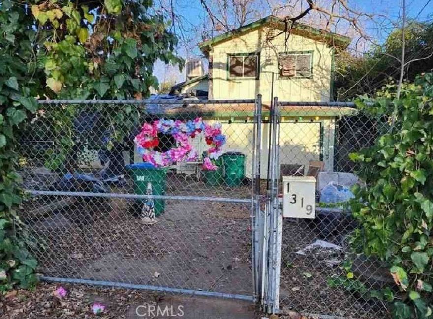 Why Rent when you can own for less in Chico, CA. This two-story home is a diamond in the rough. Records show it is a two-bedroom home with approx. 1,159 sq. ft.  It is on a good size lot of approx. 6,098 sq. ft. Roll up your sleeves and put your designer touches to make it a dream home. At this price if you blink it will be SOLD. Buyers check City, County, Zoning, Tax, and other records to their satisfaction. AS-IS SALE property.