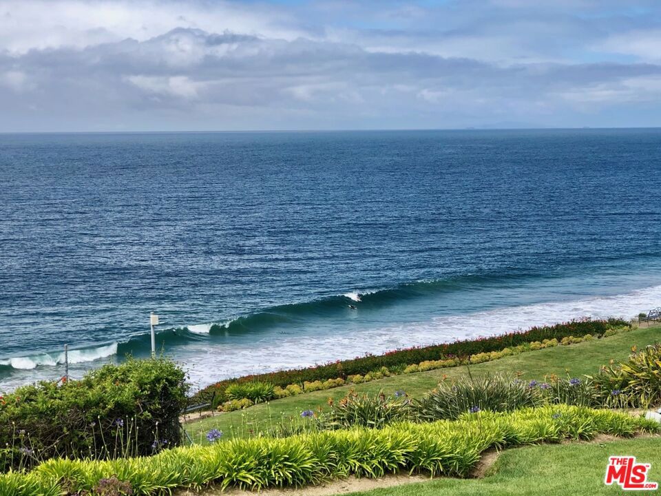 Available Now - Short term furnished rental - Available for June , July , August . Rent for any month for 30 days or longer . Stunning, front-row, 3-bedroom, 3-bath, 1588 Sqft townhome with unobstructed, 180-degree, view of the Pacific Ocean and coastline from Point Dume to the southeast across Zuma Beach to points Northwest. This premier townhome in Zuma Bay Villas opens directly to a serene garden and grass bluff. Inside the townhome, wall-to-wall windows fill with whitewater Pacific vistas and picturesque sunsets. The entry level includes an in-suite bedroom, living room, kitchen, large dining area, added loft with ample built-ins and breathtaking views, and a sizable balcony for dining and whale-watching. Downstairs has two in-suite bedrooms, each with unobstructed views and access to the oceanfront grass bluff. Locked, private, gated staircase leads from the bluff down to Westward Beach, Malibu's longest and sandiest. Dolphins play in the kelp, and sea lions nest on Point Dume, at the end of Westward Beach. Attached 2-car garage is complemented by street parking for residents and guests. Zuma Bay Villas is a 24/7 guard-gated community with immaculately manicured grounds, private tennis court, social room, and heated salt-water pool/spa. A unique blend of luxury living and unmatched, panoramic vistas.