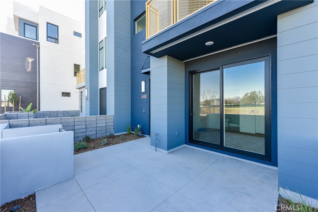 Location, Location, Location! This stunning contemporary townhome, built in 2022, is located in the most desirable spot within the Tustin Legacy community. Just steps away from The District, you’ll find Costco, Whole Foods, Target, AMC Theatres, and an abundance of dining and entertainment options all within a one-mile radius. This nearly 2,000 sq. ft. home features 3 spacious bedrooms, 3.5 bathrooms, and a 2-car direct-access garage. The first floor offers a private guest suite ideal for visitors or extended family. On the second floor, the open-concept layout includes a bright great room, a gourmet kitchen with a large quartz island, stainless steel appliances, ample cabinetry, and a dining area that opens to a balcony. The third floor boasts a luxurious primary suite with a walk-in closet, and an additional bedroom suite. A laundry room is conveniently located on the third floor. Additional highlights include solar panels for energy efficiency, and recessed lighting. With easy access to major freeways and proximity to The Market Place, South Coast Plaza, UC Irvine, and John Wayne Airport, this home perfectly blends modern comfort, convenience, and premium community living.