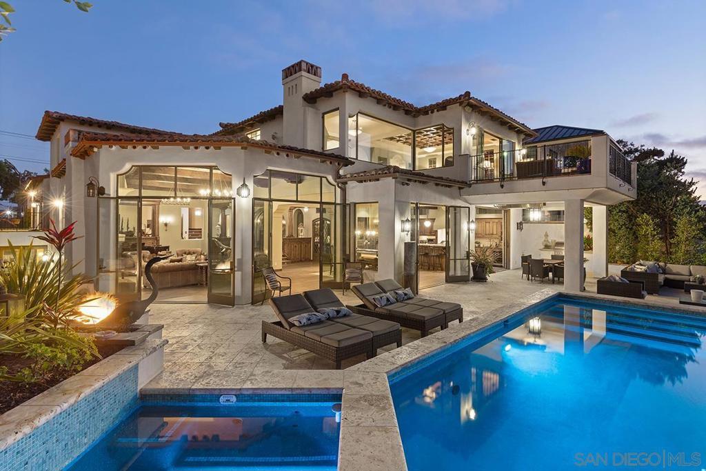 The finest waterfront living with San Diego Bay and City Skyline Views. Breathtaking open concept design with fireplace, dining area and extraordinary kitchen with center island and butler’s pantry. Floor to ceiling doors open onto the patio with outdoor dining room and infinity edge pool and spa. An elevator to all levels. The master retreat encompasses the entire 3rd level with office/den, luxurious master spa, sitting area, fireplace, wet-bar and private view deck overlooking the bay and exquisite city skyline. The compound is approx.9,100 SF w/5BR main house, 6+ car garage, and 2BR/2BA Casita. Exclusive and stylish coastal living near restaurants, shops with the most extraordinary views in all of San Diego! Built by local builder Lorton Mitchell. Designed by local architect Dorothy Howard. (AIA) This home features the following finest quality in design and finishes: Approx 68 Ft of waterfrontage. Main house with open living design with fireplace, dining area and gourmet kitchen with Viking and Miele appliances, center island, and additional butlers kitchen. Temperature controlled wine room. Inlaid wood ceiling. Impeccable fixtures and finishes throughout. Media room with full bar. Master retreat with den/office, master spa with 2 person steam shower, spa tub, sitting area with fireplace, wet-bar and view deck. Exercise room. 6+ car garage with turn table. Outdoor dining area with BBQ, fire-pit to gather, infinity edge pool and spa overlooking the most spectacular views possible in San Diego! Solar. 2 BR/2BA Casita with fireplace and full kitchen. Rooftop deck over the casita. Private Courtyard with water feature. Expansive vistas and terraces throughout. The romantic and inviting Spanish/Mediterranean design captures the essence of exotic coastal living. Equipment: Pool/Spa/Equipment Sewer: Sewer Connected Topography: LL Frontage: Bay