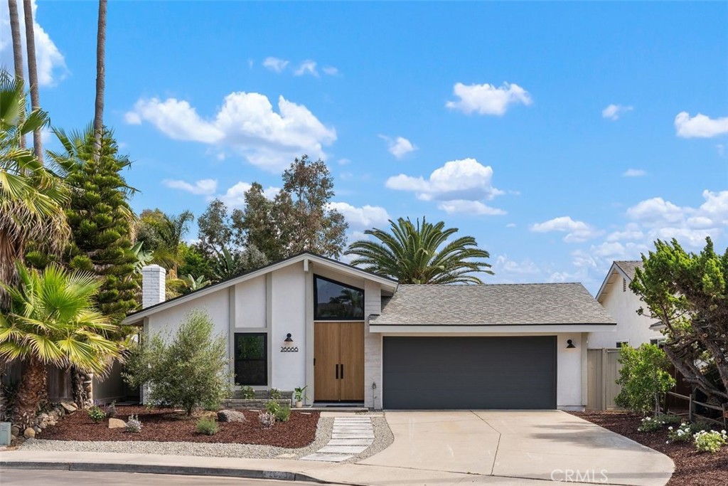 Tucked away on a quiet cul-de-sac in desirable Capistrano Beach, this fully remodeled single-level home offers the perfect blend of modern luxury and timeless coastal charm . Featuring 3 bedrooms plus a flexible bonus room (perfect for office, gym or play room), 2 beautifully appointed bathrooms, and approximately 1,576 sq ft of professionally designed living space, this home is move-in ready and thoughtfully upgraded throughout. Enter the home through custom wood double doors and be greeted by beautiful wood flooring and a tall vaulted ceiling that opens into an ideal, flowing floorplan connecting the kitchen, dining, and family room, highlighted by a stunning fireplace finished with imported Italian tile and a custom Roman clay accent. The stunning kitchen is a true showpiece, boasting high-end stainless steel appliances, large center island with seating, a custom Roman clay range hood, quartz countertops, a dramatic black leathered waterfall island, farmhouse sink, toe-kick lighting, and soft-close cabinetry. Spa-inspired bathrooms elevate the living experience with custom vanities topped with quartz counters, a large soaking tub in the primary suite, and exquisite Spanish and Italian tile finishes. Outside, enjoy a low-maintenance private yard with a patio with new pavers perfect for enjoying ocean breezes with a peek ocean view, private sitting area outside of flex room, large grassy area, updated landscaping and both drip and sprinkler systems. This home has been thoughtfully upgraded throughout, featuring a brand-new roof, all-new custom Milgard windows and sliders, updated electrical and a newly installed AC system for year-round comfort and a new garage door. High-end lighting fixtures add a touch of elegance, while solid-core doors provide both style and soundproofing. Additional enhancements include custom storage with built-in shelving and the timeless detail of shiplap, blending function with refined design. An oversized two-car garage offers ample space for vehicles and storage, complete with a convenient mud room and durable epoxy-coated floors that combine functionality with a clean, polished finish. Centrally positioned between Dana Point and the harbor, just moments from everything San Clemente offers. This move in ready home is a rare find in one of Capistrano Beach's most sought-after neighborhoods.