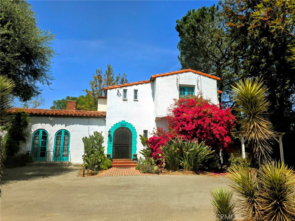 PRICE REDUCED! EXCEPTIONAL ESTATE OPPORTUNITY: RARE 26,400 SQ FT LOT - LAKE BALBOA ADJACENT
DUAL APPEAL: Premier Family Estate + Future Development Potential. Extraordinary 26,400 sq ft rare flat compound offers 5x the space of typical LA residential lots. Spanish-style main residence (2,675 sq ft, 4BR/2BA) features a desirable downstairs bedroom with adjacent full bath — ideal for relatives, guests, office/studio, or multigenerational living. Large upstairs bedrooms, each with its own walk-in closet. Central air and heating with ceiling fans throughout. Grand fireplace anchors the living space with arched entryways and French doors, creating an elegant flow. Hand-painted tile floors and thoughtful updates complement the authentic character. Owned 6.82 kW solar system, updated HVAC, plumbing, underground utility lines, and modern appliances throughout. Perfect for multigenerational living seeking space and privacy, buyers wanting estate-sized entertaining capabilities, investors interested in future development opportunities, or those seeking a unique compound with established character.
ESTATE FEATURES: Resort-style pool and backyard made for entertaining. Bonus detached studio structure with full bath and kitchen, ideal for guest quarters, home office, or creative space. Multiple fruit trees and established gardens for a private mini-orchard feel. Children’s play area and abundant recreational space. U-shaped driveway with dual gates for easy ingress/egress and extensive parking throughout the compound. Gated privacy with room to breathe.
PRIME LOCATION: Centrally located close to freeways, shopping, schools, and the amenities of Lake Balboa. Premium 91406 zip code. Strategic location approximately 0.5 miles from the proposed Sepulveda Transit Corridor station.
DEVELOPMENT POTENTIAL: R1-1/RS-1 dual zoning. ADU opportunities. SB9 lot split potential. Previously under contract for ED1 conversion — transaction terminated due to buyer missing ED1 qualification deadline. 4th bedroom permit finalized — ZIMAS update pending.