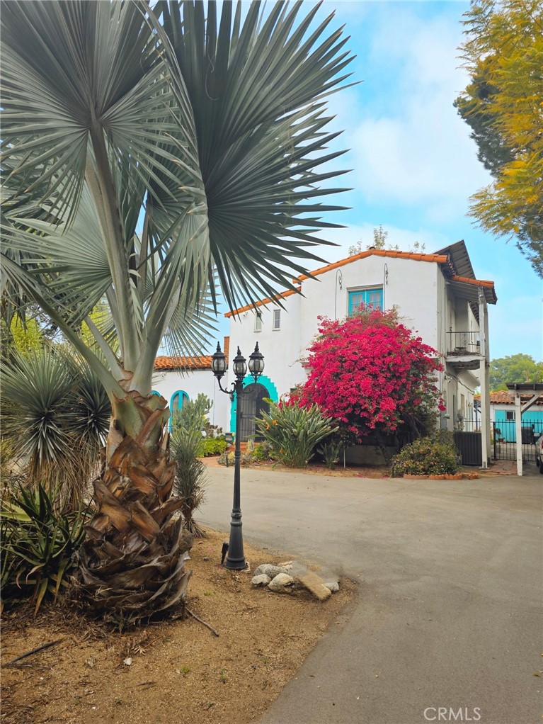 EXCEPTIONAL ESTATE OPPORTUNITY: RARE 26,000 SQ FT LOT - LAKE BALBOA ADJACENT DUAL APPEAL: Premier Family Estate + Future Development Potential Extraordinary 26,000 sq ft flat compound offers 5x the space of typical LA residential lots, creating endless possibilities for luxurious family living. Historic 1933 main residence (2,675 sq ft, 4BR/2BA) showcases authentic character with hand-painted tile floors and thoughtful updates throughout.ESTATE FEATURES: Resort-style pool with mature, private landscaping. Bonus studio structure ideal for guest quarters, home office, or creative space. Multiple fruit trees and established gardens. Children's play area and abundant recreational space. U-shaped driveway with dual gates for easy ingress/egress and extensive parking throughout compound. Gated privacy with room to breathe.PRIME LOCATION: Premium 91406 zip code with established neighborhood character adjacent to Lake Balboa recreational amenities. Well-maintained infrastructure with all utilities in place. Strategic location approximately 0.5 miles from proposed Sepulveda Transit Corridor station.DEVELOPMENT POTENTIAL: R1-1/RS-1 dual zoning may present opportunities for ADU development, potential lot split opportunities under SB9 legislation, phased development, and multi-generational compound expansion. Previously under contract in 2023 at $1.8M demonstrating strong market interest.INVESTMENT HIGHLIGHTS: 26,000 sq ft of flat, usable land increasingly rare in Los Angeles. Historic designation verified - property not listed in State historic database. Transit-oriented location with future connectivity potential. Established neighborhood with premium zip code recognition.Perfect for multi generational families seeking space and privacy, buyers wanting estate-sized entertaining capabilities, investors interested in future development opportunities, or those seeking a unique compound with established character.Private showings by appointment. 4th bedroom permit pending final inspection.BUYER VERIFICATION REQUIRED: All information regarding zoning, development potential, ADU possibilities, SB9 eligibility, permits, transit plans must be independently verified by buyer. Property information deemed reliable but not guaranteed. Buyer responsible for all due diligence regarding development possibilities and restrictions.