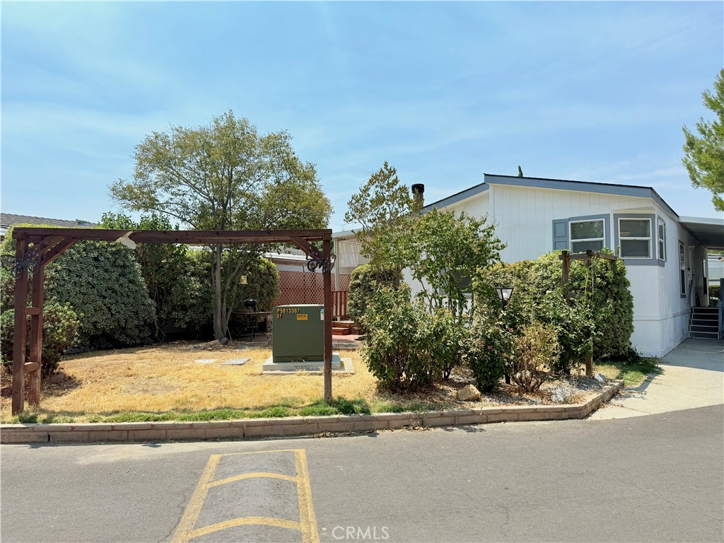 Welcome to this beautiful 55+ community, located in the highly sought-after Country Lake Community of San Jacinto. This charming 2-bedroom, 2-bath home with an additional den/office offers 1,248 sq. ft. of comfortable living space and has been recently updated for move-in readiness. Inside, you’ll find new laminate wood flooring throughout and fresh interior and exterior paint completed in the last few months. The open floor plan features a cozy fireplace in the living room, perfect for relaxing evenings, and a spacious kitchen that flows into the dining area for easy entertaining. BONUS ALERT! SELLER IS LEAVING ITEMS BEHIND! Don't Miss This Incredible Opportunity! Refrigerator, Stove, Washer & dryer, Microwave, Light fixture. ACCESSIBILITY BONUS This home features a wheelchair ramp at the entry — ideal for mobility support and added convenience. The home offers a good-sized yard with plenty of room for gardening, planting fruit trees, or creating your own outdoor retreat. Enjoy the enclosed bonus room, ideal for year-round entertainment, or the open patio space perfect for gatherings. Residents of Country Lake enjoy resort-style amenities, including a walking trail around the lake with shaded seating areas, a sparkling pool and jacuzzi, a clubhouse with an activity room, banquet/meeting hall, and a full commercial kitchen. The community also offers RV storage parking for residents. Conveniently located near grocery stores, restaurants, and with easy access to the Ramona Expressway, this home combines comfort, convenience, and community living.