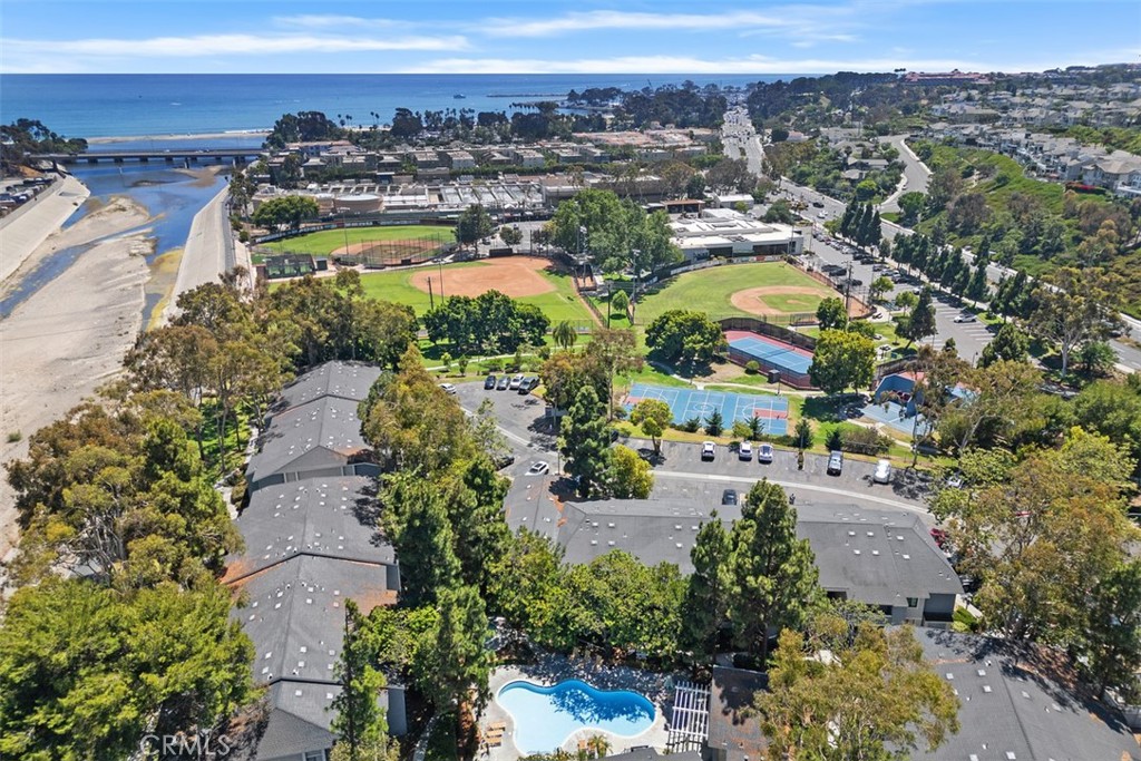 Live the coastal lifestyle in this beautifully situated 1-bedroom, 1-bath upper-end unit condo, just a short distance to iconic Doheny State Beach. Located in a peaceful community, this light-filled home offers a private patio with relaxing views of the bike trail — an ideal spot for morning coffee or evening sunsets. Enjoy the convenience of in-unit washer and dryer hookups (in a private closet on the patio), one designated parking space, and plenty of guest parking for visitors. This unit has also recently been repiped. The community features a pool and a heated spa, perfect for relaxing after a day at the beach. Nestled between Dana Point Harbor and historic San Juan Capistrano, you’ll have easy access to coastal dining, shopping, entertainment, and scenic trails. Whether you're looking for a full-time residence or a weekend retreat, this condo delivers the best of Southern California beach living.