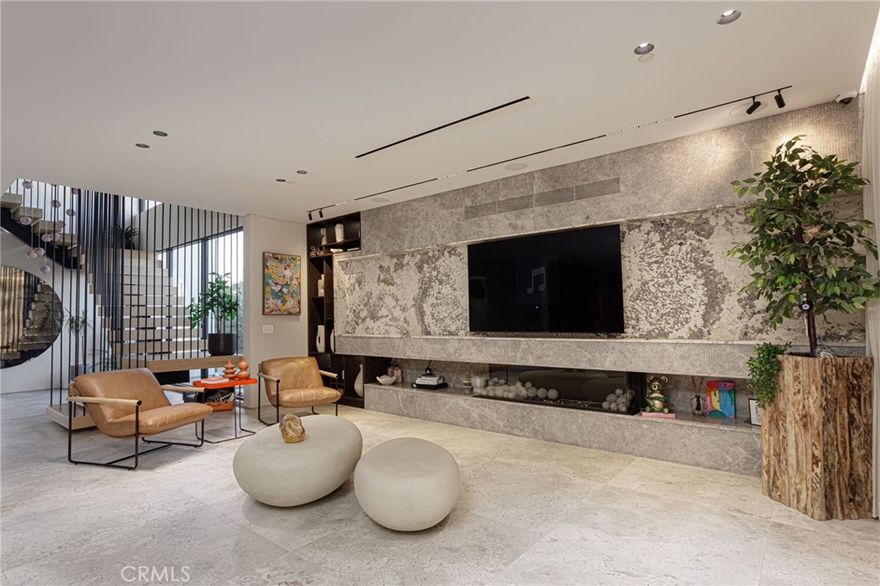 Welcome to 5106 Lindley Ave, a 2024 built modern luxury home located south of Ventura Blvd in a gated setting, offering top-tier walkability and easy access to the 101 & 405 freeways. This is not your average new construction home! Builder owned, the amount of quality upgrades and finishes is sure to leave a lasting impression. Spanning 4,326 sq. ft. of seamless indoor/outdoor flow, this home features Miele Black Series appliances, an Italian chef’s kitchen with custom stone, and a mix of Italian tile and white oak flooring throughout the homes open concept lay out. The primary suite is something out of a luxury hotel, featuring a spa-like bathroom with Italian marble and dual shower heads, as well as a custom walk-in closet and balcony overlooking the backyard. The remaining bedrooms are spacious and all offer en suite bathrooms. Designed for both luxury and entertainment, this home has it all - including multiple balconies, a movie theater, rooftop deck with full outdoor kitchen and impressive views of the valley below. The backyard features a pool and spa with pebble tech finish, and a rec room with convenient access to bathroom and steam shower. Additional features include a central vacuum system, direct access to a two-car garage, a Control4 smart home system, full security, and an owned solar system. The list goes on, must see in person!