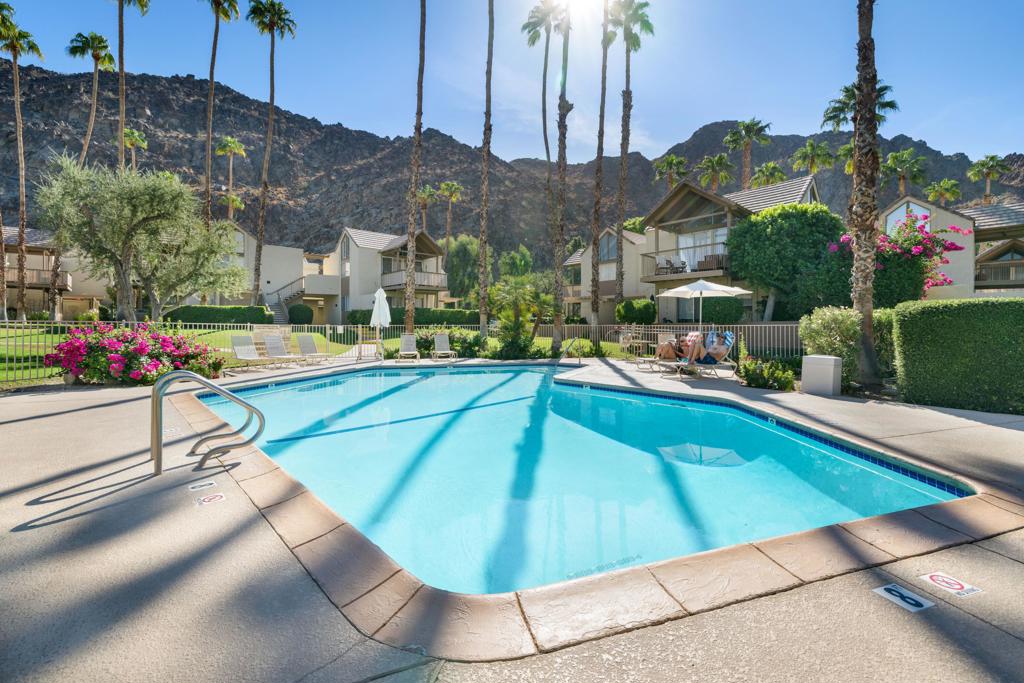 Location, Location, Location! Wake up to panoramic views of the sparkling resort-style pool and majestic mountains from this beautiful, lower-level condo in the highly desirable Mountain Cove Community. This rare gem features one-bedroom, one-bathroom, a charming kitchen, and cozy living area-plus two spacious patios that open directly to stunning poolside scenery. New AC unit (installed in 2024) Fully Furnished! Owners of Indian Wells enjoy significant advantages (discounted golf, spa and shopping, along with access to great fitness facilities a short drive away) This Community is amenable to short-term stays (7 days minimum).