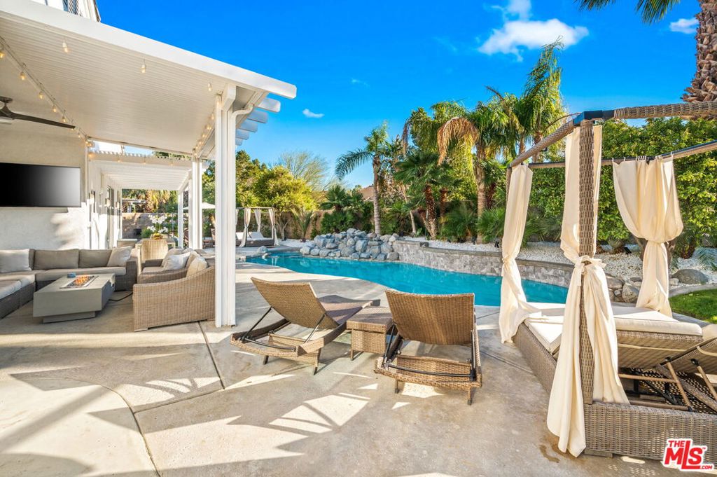 Please call for pricing varies depending on the month. 29 Day Minimum rent. 4 bedrooms, 3 bathroom. Can sleep up to 12 people. Property is 7 minutes from downtown Palm Springs close to all the restaurants and bars. Salt Water Pool, Firepit, Outdoor Dining table, Cabanas, Movie Theater w/ pingpong, pool table, and playstation. This home has a large private back yard perfect for entertaining. It features a brand new swimming pool, heating, LED lights, and waterfall. The two person cabana next to the pool will make you feel like you are in paradise! There is a large covered patio with comfortable seating and a firepit to keep you warm on those cool nights. There is also an outdoor dining table and a large grill for BBQ'ing. The home features four bedrooms and 3 bathrooms. Master Bedroom - We call this our Beige room. Very unique with two queen beds and a beautiful designed wallpaper behind the beds. This luxurious room will make you feel like you're truly living the royalty life. Has a combo of Beige and gold colors with a 55 Inch flatscreen TV. This bedroom will sleep 4 people and is connected to the Master Bathroom and has a large walk in closet.The master bathroom is done in a Beige gold and has a Shower along with a large golden hot tub where you spend a night of romance sipping on the wine and spoiling your loved one. The 2nd bedroom we call the Grey Room. This room has a King size bed with beautiful finishes and furniture. Comes with a 55 Inch flat screen TV. This bedroom is perfect for a couple looking to share a larger sized bed. Comes with a large closet.The 3rd and my favorite is our Black Bedroom. This is the most masculine bedroom in the house. that comes in black and gold colors with a bull head on the wall. The walls are covered in a black and gold wall paper with a huge king size bed. You can call this the bachelor room however this is great for couples looking to feel like they are away from home. This also has a 55" TV for entertainment. This bedroom is only a few feet away from the second bathroom. Has a large closetThe next bathroom is the black and gold bathroom which complements the black bedroom. This bathroom comes with a dual vanity and a black and gold shower. The 4th Bedroom has a TV and a Queen sized bed. Very roomy and comes with a small closet.The house has a living room with two couches that fold out into beds. Has a beautifully tiled fireplace with a 65 inch TV to kick back after a long day relaxing by the pool. Speakers are hooked up in the ceiling to play music in the living room. The dining table in the corner of the living room sits 10 people. Excellent place to sit down and have dinner with the family and friends. The kitchen Is very big and has a bar that seats 4 people. Comes with a huge stainless steel fridge, stove, microwave, and dishwasher. Excellent for entertaining large groups. As you make your way to the back of the kitchen towards the front of the house. There is a walk in pantry with plenty of shelving to store food. After walking past that, we have our beverage center bar. This is where you can store all your alcohol. We have a wine cooler-fridge, and a separate beer-cooler fridge where you can keep your drinks chilled. We also have a beautiful bar-cart where you can take your drinks with you anywhere in the house. The kitchen has a door at the back of the house that leads to the bbq and pool. Easy to carry drinks and food back and forth.In the corner across from the bar we have an office where you set up your work station. We have a printer, all you have to do is plug your laptop into it. The desk is fairly big and will have office supplies you can use. We save the best for last. Movie Theatre/Game Room has an 85 inch TV where you can sit down on large couches and watch movies. There is also a Pool Table and ping pong table for those looking for the extra entertainment.