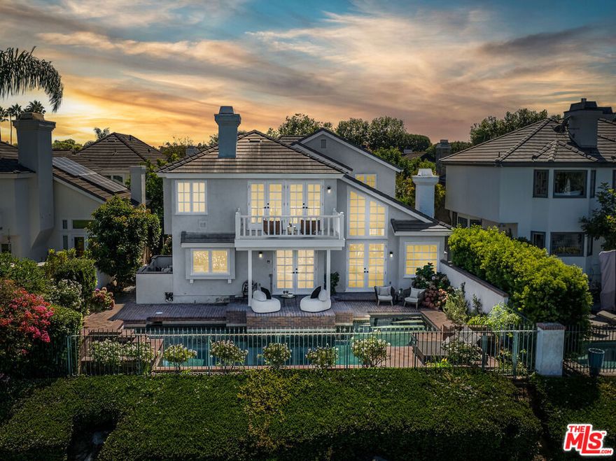 This prestigious guard-gated community is home to a rare opportunity: a fully restored and thoughtfully renovated estate that blends timeless character with modern living. With nearly 4,000 square feet, 4 bedrooms, and 3.5 baths, this light-filled residence sits perfectly on the golf course, showcasing a sparkling pool, spa, and breathtaking views. Lovingly maintained by the same family for 38 years, this turnkey home is ready for its next chapter. Set back from the street, the entrance welcomes you with a grand walkway, lush greenery, and a calming fountain. Inside, soaring ceilings, a dramatic chandelier, and dark hardwood floors set the stage. The main level offers two distinct step-down living areas: one with arched doorways, a fireplace, a formal bar, and an interior courtyard with fountain; the other with a chic, vacation-inspired vibe and another fireplace. A formal dining room overlooks the living space, perfect for gatherings, with French doors opening to the side yard. An office/bedroom or nanny's room with built-ins, French doors, and a newly redone en suite bath completes this wing. At the rear of the home, the chef's kitchen shines with white cabinetry, polished nickel fixtures, top-of-the-line appliances, and honed Calacatta marble countertops, overlooking the golf course and pool. A sunny breakfast area, spacious laundry room, powder room, and ample storage round out this level. Up the grand staircase, illuminated by the chandelier, the primary suite enjoys its own private wing. This serene retreat features a spa-like bath with a freestanding soaking tub and picturesque views, a Restoration Hardware double vanity with Signature fixtures, a large shower, fireplace, and two walk-in closets awaiting custom design. A private terrace offers yet another place to savor morning coffee or quiet moments. At the opposite end of the hall, three generous bedrooms provide flexibility for family, guests, or a lounge/playroom with access to a private patio. These rooms share a spacious bathroom. Thoughtful details include a laundry chute from the upper level, delivering clothing directly to the laundry room below. The backyard is an entertainer's dream, tranquil and inviting with a pool, spa, fountains, and seamless indoor/outdoor flow overlooking the one of the best 18-hole championship golf courses in SoCal. Practical features include a three-car garage (two with direct access), driveway parking for six, and ample guest parking. Beyond the gates, The Huntington Club offers optional membership with tennis, pickleball, pilates, gym, and more. Just blocks from the beach and minutes to Downtown, top-rated schools, parks, oceanfront dining, and the iconic pier, this home places you at the center of the best Huntington Beach has to offer. A short drive takes you to Long Beach, Newport's Fashion Island, Balboa, and Lido Island.This isn't just a home, it's a lifestyle. This is living.