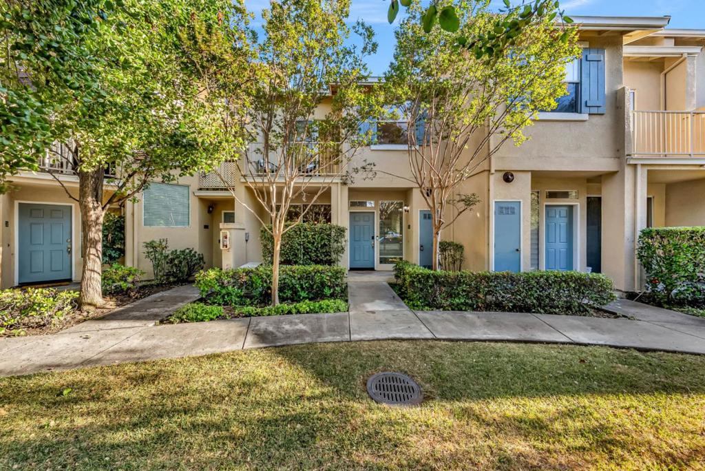 This comfortable townhome style condo is centrally located for an easy commute. Engineered Maple hardwood flooring downstairs in the living and dining rooms and kitchen. The kitchen features stainless steel appliances with the fridge included in the sale. The gourmet chef will enjoy the gas oven and cooktop range and efficient U-shaped counters. And there's a double kitchen sink plus a breakfast counter with designer lights. High ceilings and large windows bring in lots of light. Some less noticeable amenities in the home are the central AC, the water softener and water purifications system both of which are owned and come with the property.There is also a gas fireplace to make it cozy when there's a chill. electric washer/dryer, two car garage, breakfast nook, double panned windows. The primary bedroom has a walk in closet, double sinks in the bathroom and a balcony. Common areas include a swimming pool and jacuzzi. The association is well run with relatively low HOA dues.