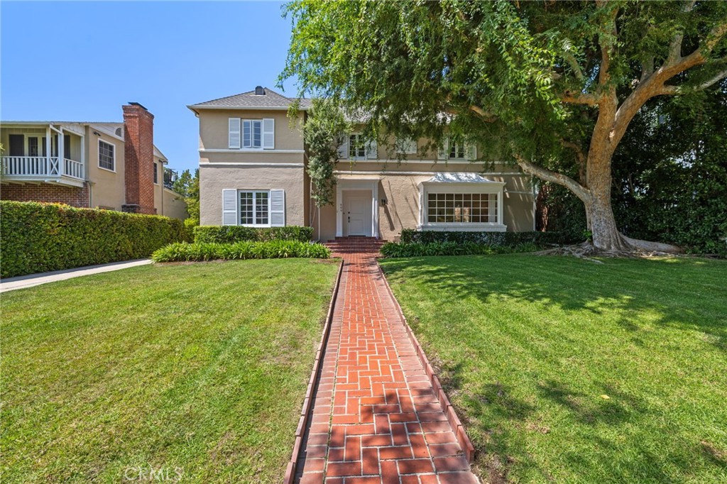 First time on the market in decades, this beautifully staged 1937-built Colonial-style residence offers 5 bedrooms and 4 bathrooms across 3,967 sq. ft. of timeless elegance on a .26-acre lot in one of Beverly Hills’ most coveted neighborhoods. Recently renovated with a fully updated kitchen, new windows, and upgraded lighting throughout, the home blends classic charm with modern luxury.
An impressive spiral staircase makes for a dramatic entry, setting the tone for the craftsmanship found throughout the home. The formal living and dining rooms feature bay windows, wainscoting, and crown molding, while Dutch doors throughout add to the charm. The living room also includes a built-in mini bar, perfect for entertaining.
The serene master suite opens directly to a private deck, creating a seamless indoor-outdoor retreat ideal for morning coffee, evening cocktails, or simply enjoying the Southern California weather. Additional bedrooms provide flexibility for family, guests, or office space.
Outdoors, enjoy a sparkling pool with lounging area, relaxing jacuzzi, generous patio ideal for gatherings, and a two-car detached garage with an attached storage room. All furnishings are offered for sale with the property, creating a truly turn-key Beverly Hills lifestyle.
Served by top-rated schools, this home is nestled in the heart of Beverly Hills—one of the most prestigious and desirable communities in the world. Known for its tree-lined streets, unparalleled shopping and dining, vibrant culture, and close-knit neighborhood feel, Beverly Hills offers a lifestyle of elegance, convenience, and enduring value that is simply unmatched.
