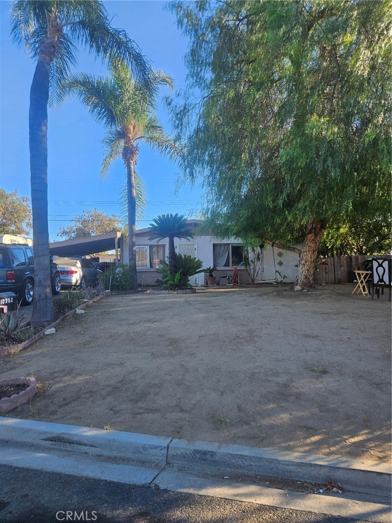 Single-story home in the La Sierra area of Riverside featuring 3 bedrooms and 2 bathrooms. This home has a spacious lot with a covered carport and extra driveway parking. The interior needs some work, making it a great opportunity for investors or buyers looking to add their own touch. Convenient location near schools, shopping, and the 91 Freeway