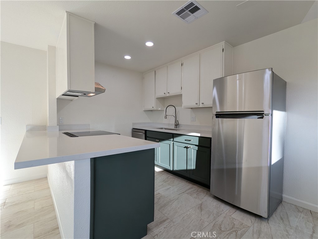 Step into this beautifully updated two bedroom, one bathroom duplex that combines modern comfort with desert charm. This thoughtfully remodeled home features an open-concept layout with stylish upgrades throughout including new recessed lighting, ceiling fans, fresh paint, new flooring, updated electrical wiring, sleek hardware, and energy-efficient dual-pane windows. The kitchen boasts top-notch appliances and finishes designed to make you feel right at home. Enjoy the spacious outdoor living areas, including a large back and side yard perfect for relaxing under the desert skies and taking in stunning views of both the San Jacinto and San Gorgonio mountains. A cozy porch right outside your front door offers a tranquil space to unwind, and you’ll love the seasonal grapefruit tree just steps away. Additional features include: Shared high-end washer and dryer, two-car tandem parking (including one covered spot), AC unit only 6 years old, and partially refinished roof. Tenants are responsible for gas, electricity, and shared water with the neighboring unit. Situated on a nearly 7,000 sq ft lot in the heart of Palm Desert. You’ll be just a short walk to El Paseo, Westfield Mall, McCallum Theatre, College of the Desert, Civic Center Park, The Living Desert, golfing, and more. Enjoy the perfect blend of peace, style, and convenience in this exceptional rental opportunity.
