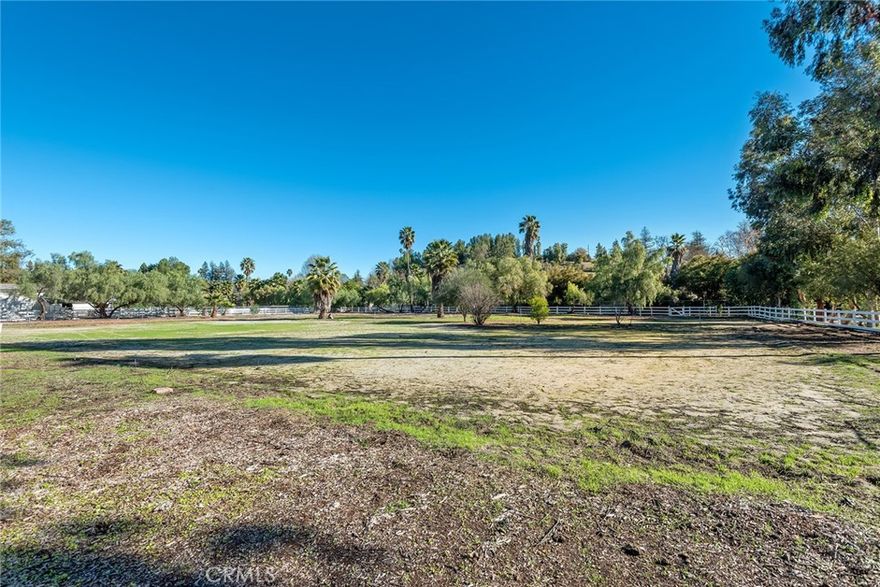 This spectacular 2.5 acre, huge flat lot is nestled at the very end of a quiet cul-de-sac. It offers room to build your dream estate with every amenity on parklike grounds. This is one of the very largest, flat lots in all of Hidden Hills. Soils report and survey are available. The property is sold AS-IS for land value only.