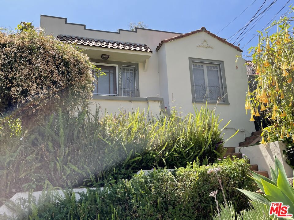 A rare opportunity to acquire a secluded compound in the sought-after Echo Park neighborhood of Elysian Heights. This special property features four distinctive units across three charming Spanish bungalows, each offering hardwood floors, period kitchens and baths, views, original architectural details and private outdoor spaces. The crown jewel of the property is a stunning three-story townhouse, boasting 2 bedrooms, 2 bathrooms, and a private ground-level entrance - perfect for an owner-user or premium rental. All units have been thoughtfully renovated and well maintained, offering strong market rents. High demand for these vintage renovated units & they have always rented quickly. Explore the serene neighborhood and see why this area is in high demand with great options for food and drink at Lady Byrd Cafe, Canyon Coffee, Valerie Echo Park, Bacetti Trattoria, Tilda, Cookbook Market, Elysian Park hiking trails and local shops. Ideal for investors seeking a return approaching a 5% CAP or for your personal residence looking to offset mortgage costs with rental income. Please do not walk the property or disturb tenants.