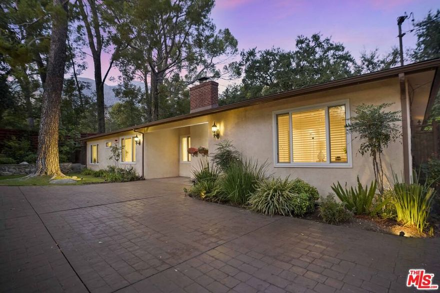 Experience the perfect blend of indoor and outdoor living in this stunning single-story 3-bedroom, 2-bathroom Altadena home, just minutes from scenic Eaton Canyon. Situated on a large, private lot with majestic oak trees and lush landscaping, the property offers serene mountain views and a peaceful retreat.Inside, expansive windows bring the outdoors in, filling the home with natural light and seamlessly connecting the living spaces to the beautiful surroundings. The circular driveway provides plenty of parking for guests, adding both convenience and charm. Move-in ready and meticulously maintained, this home combines comfort, privacy, and elegance in a truly remarkable setting.