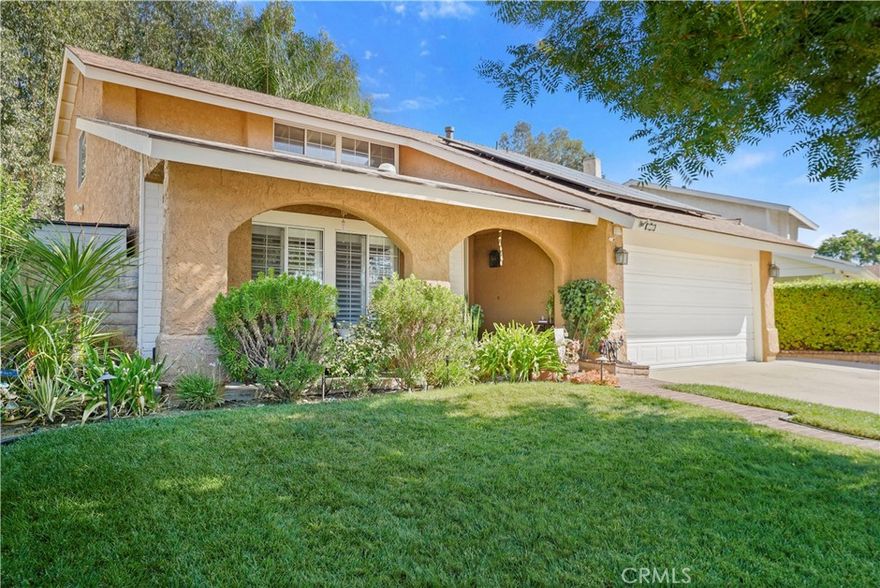 Location! Beautiful & Spacious...LOW HOA NO MELLO ROOS 4+3 Home with energy efficiency & resort-style backyard. This impeccable home features: an open & bright floorplan, a specious living-room w/high ceilings, newer interior paint & beautiful white window shutters, adjacent to the dining area w/all natural light.  Kitchen w/granite counters and backsplash, an abundance of detailed cabinets, stainless steel appliances & built in microwave, enjoy the garden window w/a fabulous view of the resort style backyard. The Family room features a cozy fireplace to warm any winter night and an open layout making it ideal for relaxing or entertaining. The French doors w/dual pane windows connect indoor living to your private backyard retreat. Main floor: 1 bedroom & full bathroom (mother-in-law or guest room). Upstairs: Spacious Master bedroom with vaulted ceilings, private bath (deep soaking tub) & walk-in closet. 2 additional bedrooms with (Jack N Jill) bathroom.  Throughout recessed lighting, custom light fixtures, ceiling fans. Solar panels - newer.   Enjoy the tranquility of this backyard with its newer patio cover, fruit trees and a variety of green plants, boasting lush landscaping, large grassy area with front and back auto sprinklers and lots of privacy.  Direct access 2 car garage plus storage area, laundry area w/sink, newer water heater. Ready for anyone seeking comfort and quality! Front yard nicely manicured. Enjoy the community pool, park, pickle ball and tennis courts. Close to schools, shopping and hiking trails.