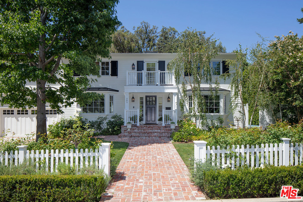 Much admired Classic Trad Estate painstakingly remodeled and expanded by the current owner w/ the finest taste, quality & attention to detail. Wonderful street presence, open flr plan, sun-filled spaces, extensive millwork & French drs throughout open to expansive, park-like yard w/ very large lawn, pool/spa, sport court & outdr living rm w/ FP and television. Main level includes inviting entry, formal dining rm, office, living rm, cooks kitchen, sunny breakfast area & large open family rm. Upstairs there is a second family rm, 3 generous secondary bedrms, each w/ vaulted ceilings & walk-in closet, and a fabulous master suite overlooking the pl & grounds w/ vaulted ceiling, gorgeous marble BA and large fitted closet. Clean lines, wide European white oak floors, crown mouldings, wainscoting & wood ceilings create a fresh Transitional feel for the interiors. Located on one of the most desirable streets in Brentwood, this timeless home is in absolute pristine condition. A rare offering!