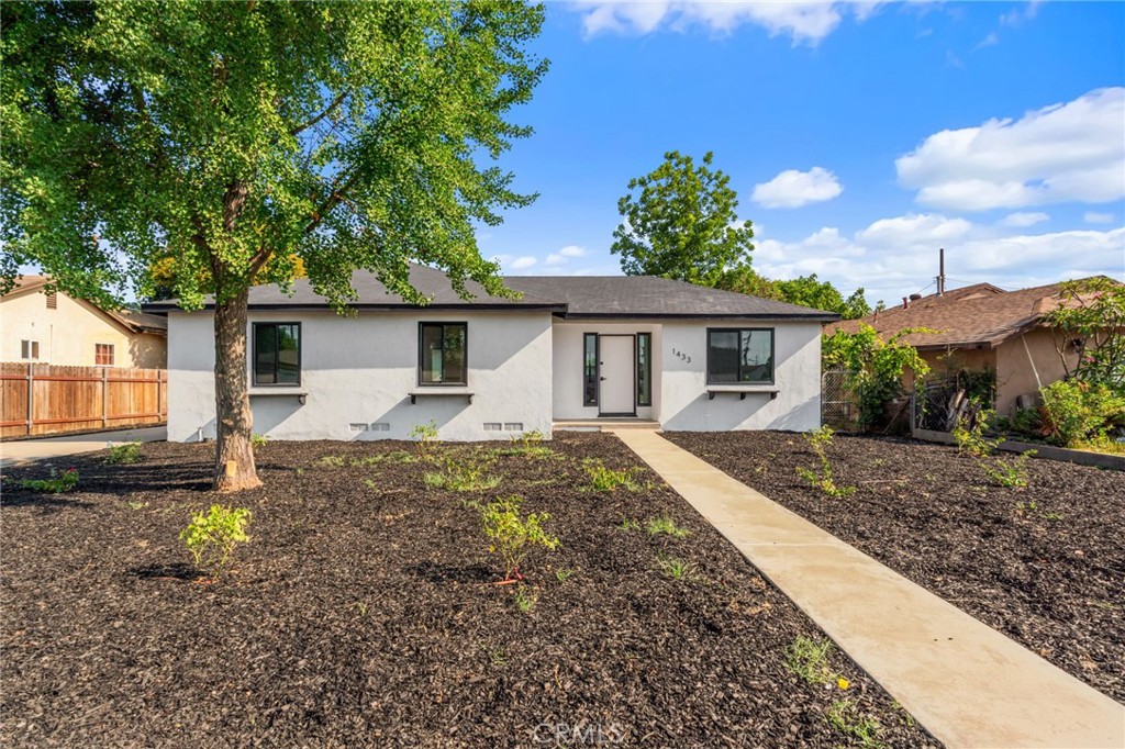 Welcome to 1433 Ashport St, a beautifully updated 3-bedroom, 2-bathroom home nestled in a quiet neighborhood of Pomona. Built in 1953 and thoughtfully remodeled, this 1,200 sq ft residence sits on a spacious 7,514 sq ft lot, offering both comfort and outdoor potential. Step inside to discover fresh new flooring, stylish interior paint, and fully renovated bathrooms featuring modern finishes. The upgraded kitchen boasts new cabinetry, countertops, and appliances—perfect for cooking and entertaining. Each bedroom is filled with natural light and updated to reflect contemporary style and comfort. With a large backyard and a functional layout, this move-in-ready home is ideal for families, first-time buyers, or investors. Conveniently located near schools, parks, shopping, and freeway access. Don't miss your chance to own this turnkey gem in a prime Pomona location!