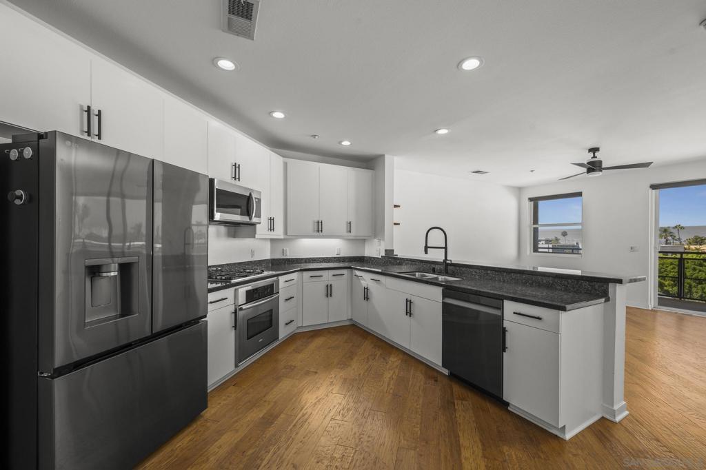 Welcome to ATLAS — a premier 5-story building in the heart of Hillcrest! Just one block from Balboa Park and surrounded by a variety of cafes and dining options, this beautifully maintained and move-in ready condo offers an ideal blend of comfort and convenience. This spacious, open-concept one-bedroom floor plan features a large kitchen with refurbished cabinets and a pantry, seamlessly flowing into an oversized great room — perfect for entertaining or relaxing. Step out onto a serene, oversized terrace with treetop views, creating a peaceful retreat in the city. The generous bedroom includes a walk-in closet and blackout window coverings, with remote-controlled shades for added comfort. Recent upgrades include: • Ceiling fans and modern lighting • New refrigerator and dishwasher • Updated flooring in the bedroom and hallway • Renovated bathroom with updated lighting and mirrors Enjoy all the top-tier amenities ATLAS has to offer, including a pool, spa, fitness center, and stylish indoor/outdoor entertainment spaces. Additional perks include assigned parking close to the elevator, EV charging stations, and guest parking. Don't miss this rare opportunity to live in one of Hillcrest’s most desirable communities!