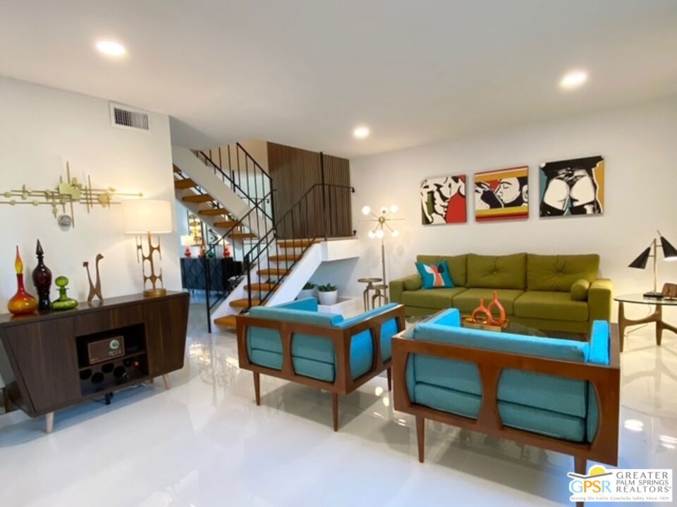 Here it is folks! This stylish 3 bedroom, 1.5 bath townhouse is move-in ready! Great mid-mod vibes in this spacious open floorpan with a private patio and direct access to two covered parking spaces and extra storage. Kitchen updated with newer appliances. 2 updated bathrooms and gleaming tile floors. The cantilevered floating stair case is a dramatic focal point! Great location, with easy access to schools, restaurants and shopping. Gated community with two pools and spas. Minimum rental rule of 30 days.