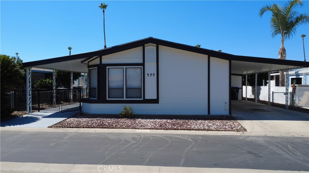 Beautifully renovated and move-in ready, this spacious 2-bedroom, 2-bath doublewide mobile home with a bonus room is located in the desirable Colonial Country Club, a 55+ community in Hemet. The home features a functional layout with a large living area, dining space, and a versatile bonus room ideal for an office, guest space, or hobby area.
Recent renovations include new vinyl plank flooring throughout, quartz countertops, updated kitchen cabinetry, interior and exterior paint, recessed lighting, ceiling fans with remotes, and updated bathrooms with a backsplash accent, dual sinks, and a jacuzzi tub. The kitchen is equipped with a dishwasher, brand new stove, and microwave. Additional highlights include an indoor laundry room with hookups, storage cabinets, a utility sink, and an outdoor storage shed.
Located within Colonial Country Club, residents enjoy access to a wide range of amenities including:
18-Hole Executive Golf Course
6 Newly Built Pickleball Courts
Year-Round Swimming Pool & Spa
Indoor Shuffleboard Courts
Billiards Room
On-Site Hair Salon
Ballroom, Bridge & Card Rooms
Fitness Center
Horseshoe Pits
Pet-Friendly Environment
This turnkey home offers the perfect blend of comfort, convenience, and active senior living.