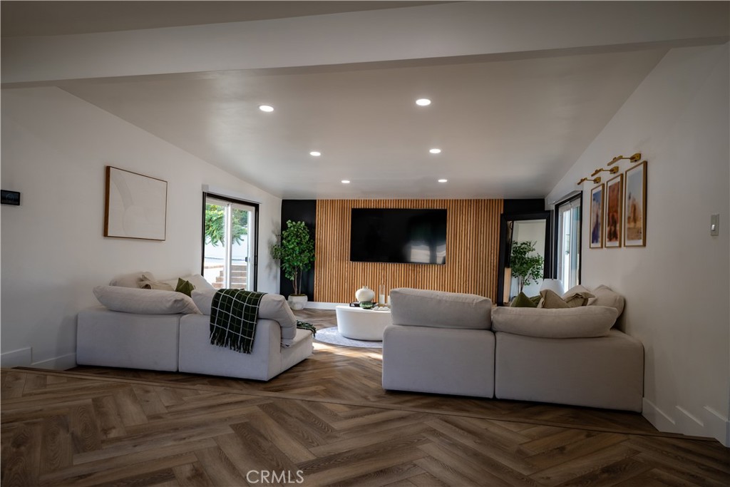 Welcome to 2047 Angelcrest Drive, a beautifully renovated home in the heart of Hacienda Heights offering a rare blend of custom design, open-concept living, and resort-style outdoor amenities. This 3-bedroom, 2-bathroom residence also includes a versatile den or office, perfect for remote work or a creative space. With nearly 2,000 square feet of living space on a generous 0.32-acre lot, this home stands out with its architectural character, thoughtful layout, and premium upgrades.
Step inside to find all-new herringbone-patterned luxury vinyl flooring, smooth ceilings with recessed lighting, and custom wood accents throughout. Every window features sleek custom roller shades for privacy and style. The open floor plan flows seamlessly into the designer kitchen, which includes waterfall quartz countertops, a built-in JennAir refrigerator, microwave, and dishwasher, a farmhouse sink, and modern cabinetry—ideal for both entertaining and daily living.
The home is equipped with a newer HVAC system for year-round comfort and solar panels on a lease, helping reduce energy costs.
Outside, enjoy your own private retreat featuring a newly remodeled pool and spa, a custom elevated deck with a built-in fire pit, and low-maintenance artificial turf landscaping. A brand-new two-way driveway offers parking for up to seven cars, along with a one-car garage that includes built-in storage. Additional upgrades include a brand-new roof and updated exterior finishes.
Located on a quiet street in a desirable neighborhood, this move-in ready home offers the perfect combination of luxury, comfort, efficiency, and unique architectural design.