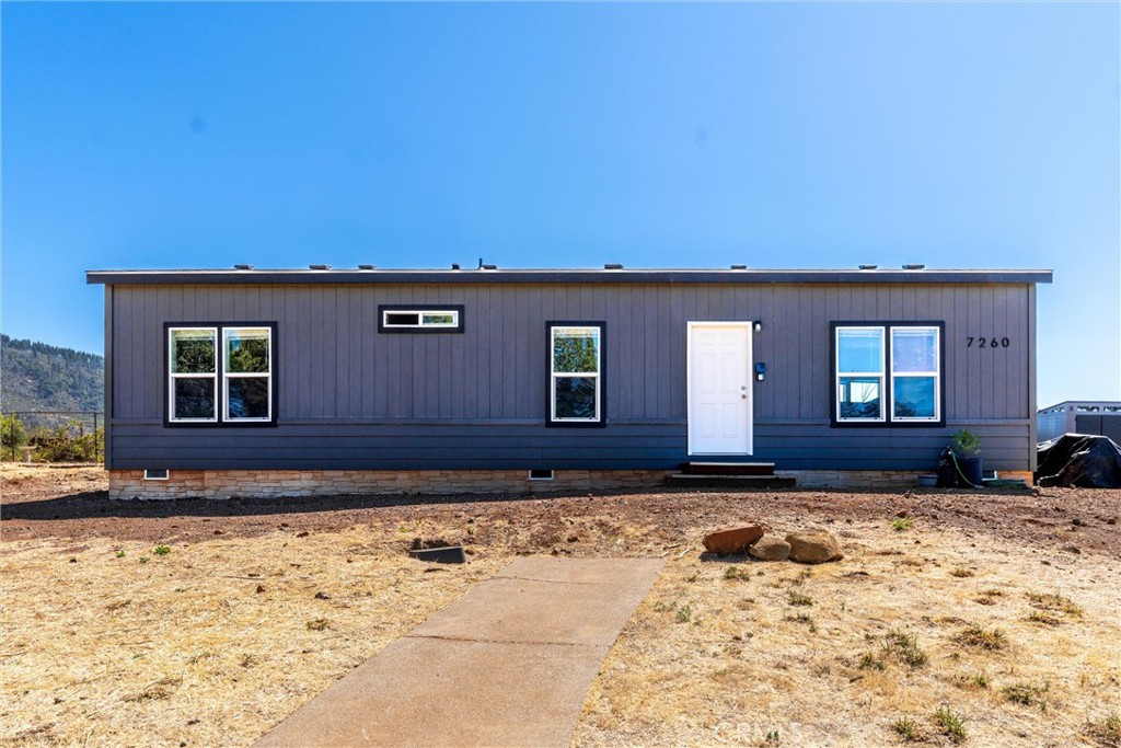 Welcome to this lovely, newer manufactured home built in 2024, located in the peaceful upper Paradise area. This three-bedroom, two-bathroom home sits on a spacious 0.6-acre lot that offers plenty of privacy as it sits back off of the road. Enjoy breathtaking views of Sawmill Peak from inside the home and from around the property. This energy efficient home boasts tall ceilings with recessed lighting in the kitchen and dining areas creating a bright and modern atmosphere. The large primary bedroom has its own private bathroom as well. As an added bonus, this property also features two septic systems and plenty of space for a potential second home or ADU making it a versatile and valuable investment. Don't miss out on this exceptional property!