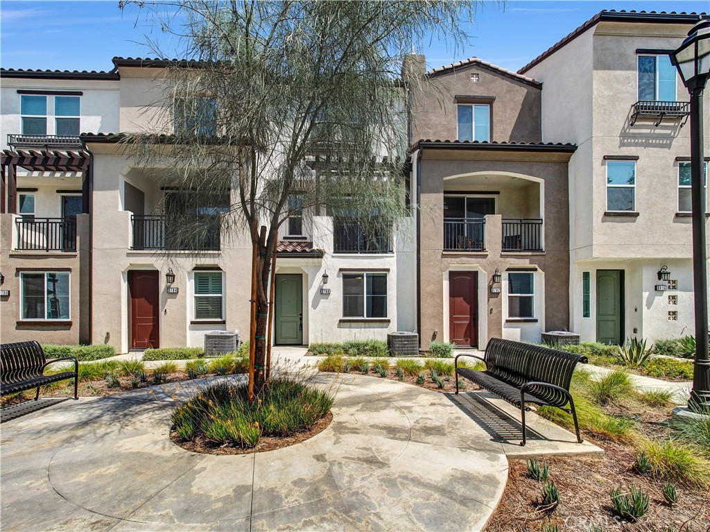 Beautiful newly built 2024 townhome in gated community with popular 3 bedrooms and 3.5 bathrooms floorplan. This home features luxury vinyl flooring throughout and stylish gourmet kitchen with new appliances. Enjoy the bright spacious and cozy living room retreat with access to balcony. The first floor bedroom suite with full bath is perfect for home office or guests. This unit comes with fully paid solar panels and professionally installed EV charger. 2 car garage with direct access to the home plus visitor parking. This is a great, gated private community featuring a modern design with picnic area, perfect for relaxation and entertainment. Convenient access to freeway 210 and Historic Route 66, located near parks, shops, schools, and restaurants.