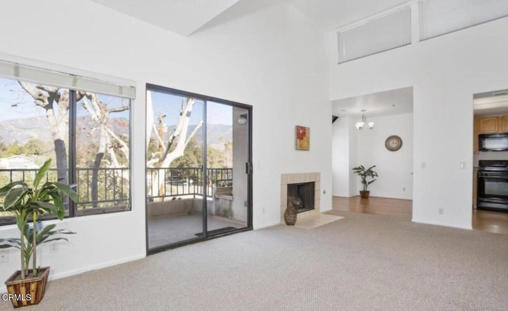 Excellent Pasadena Location!  Beautiful top-floor condo with a bright, open layout and high ceilings. This north-facing unit offers tranquil treetop views and two spacious primary suites, each with its own full bath and generous closet space. Features include an updated kitchen, dining area, living room with fireplace, private balcony, in-unit washer/dryer, and refrigerator. The gated community offers secure entry, BBQ area, and two subterranean parking spaces with ample storage. Conveniently located near the 210 Freeway, shopping, and Pasadena's finest restaurants--this is a rare find in a prime location!